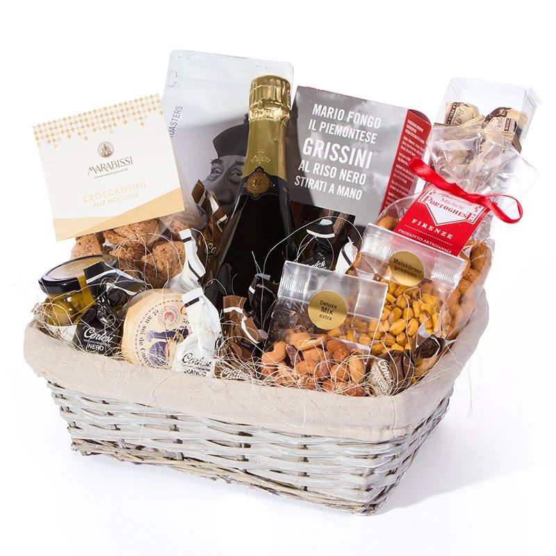 Geschenkkorb mit Champagner, Grissini, Nüssen und mediterranen Feinkost Spezialitäten im Präsentkorb