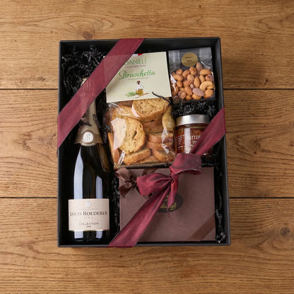 Champagner Geschenkbox mit Pralinen und Snacks in edler Verpackung mit Schleife